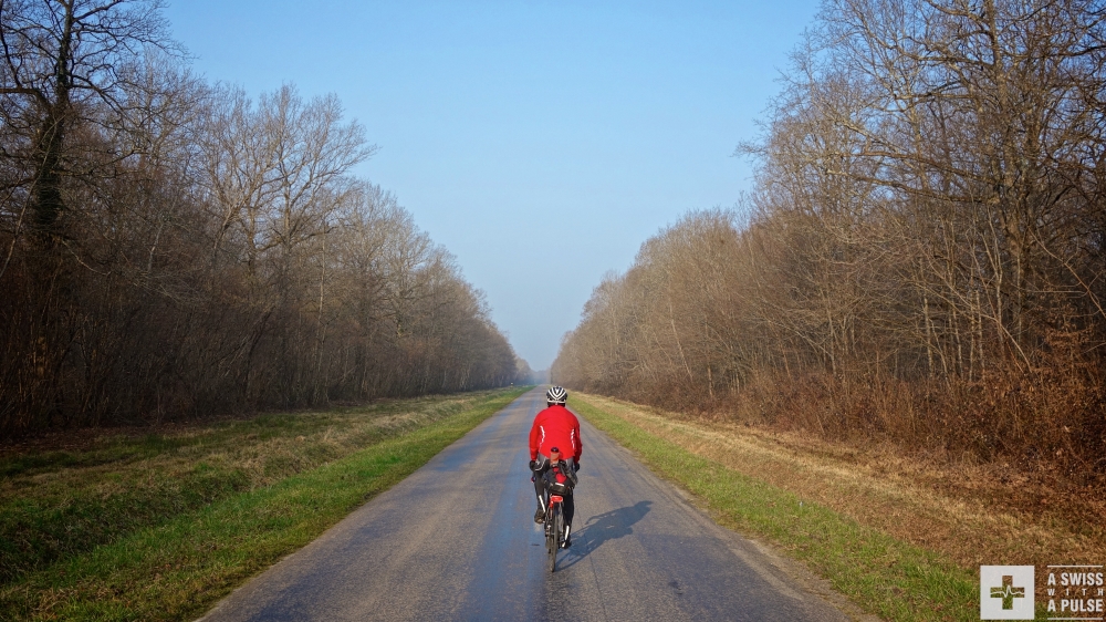 Chris riding on the quiet roads of French Jura